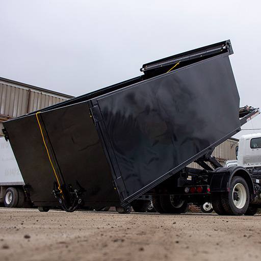 switch-n-go-industry-franchised-junk-hauling-black-junk-dumpster-unloading